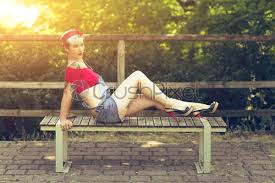 Pin up hairdos ooze a ladylike appeal and unique appeal. Young Blonde Pinup Girl With A Red Bow In Her Stock Photo Crushpixel