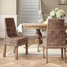 Outdoor wicker dining chairs featuring coastal styling remain true to form with classic spindle accents, basket patterning and elegant curves. Coastal Wicker Rattan Kitchen Dining Chairs You Ll Love In 2021 Wayfair