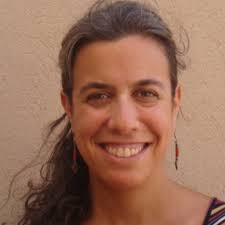 Are there any researchers who study the effects of yoga or wellness  programs for employees at work?