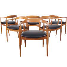 Set of four danish modern design inspired uk mcm rosewood and mahogany armless dining chairs with black vinyl seats. Danish Modern Dining Chairs By Niels Eilersen At 1stdibs