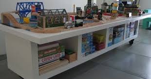 Turn An Ikea Shelf Unit On It S Side Add Wheels And A Sheet Of Plywood On Top Paint It And It S A Great Play Stat Kids Train Table Ikea Kids Ikea Table Hack