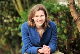 Georgie white perforated faux leather moto jacket. Georgie Nightingall