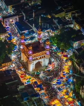 Illuminated Charminar overlooking heritage street markets, AI generated