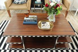 Make it personal, because this space actually says a lot about the type of person strive for an odd number of items (a book, a vase of flowers, a small piece of art) as this arrangement is visually interesting, without looking cluttered. How To Style A Family Friendly Coffee Table