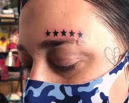 Image result for quirky pylon forehead tattoo