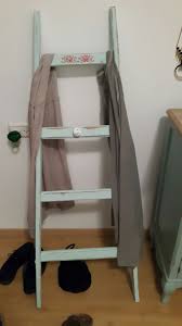 Turning An Old Ladder Into A Cloths Hanger Old Ladder Bookcase Ladder Bookcase
