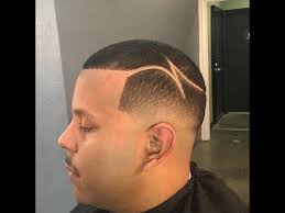 Asking your barber for a bald fade on the back and sides is only half the haircut puzzle. Bald Fade Low Fade W Part Design Bald Fade Fade Haircut Haircut Pictures