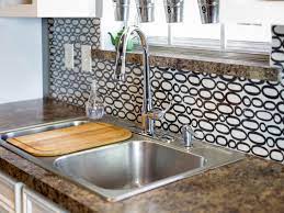 There's this cool tutorial on markmontano which explains how to paint a backsplash with your fingers and make it look amazing. Make A Renter Friendly Removable Diy Kitchen Backsplash Hgtv