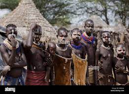 Young topless female teens and children of the Karo tribe. Photographed in  the Omo Valley, Ethiopia Stock Photo - Alamy
