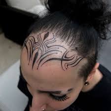 Image result for quirky pylon forehead tattoo