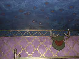 The light filters through creating a colorful effect on he hanging surface. Painted Gold Leaf Stars To Midnight Blue Ceiling And A Squiggle Border Midnight Blue Paint Painted Ceiling Decorative Painting