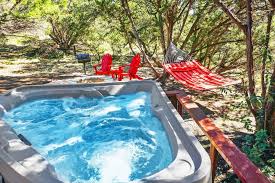 There is a bedroom and bathroom with a tub/shower combo downstairs as well as a private door to the back deck and hot tub. Cozy Cabin Holiday Home Wimberley