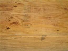Close up of the motivator in action, smoothly tapping in tongue and groove plywood floor sheathing. Amerhart Flamepro Fire Retardant Treated Wood Tongue Groove