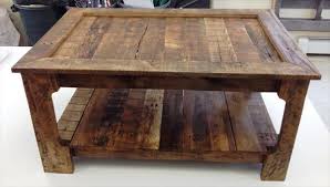 A raised top pallet coffee table that comes with slim wooden legs and it can also be finished for a custom appeal! Rustic Coffee Table From Shipping Pallets 101 Pallets