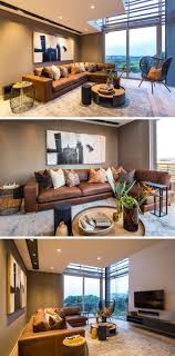This Modern Living Room Has A Large L Shaped Brown Leather Couch And A Black Detailed Brown Living Room Decor Living Room Warm Living Room Decor Brown Couch
