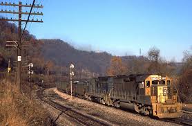 A relatively rare action photo of Baltimore & Ohio GP40-2 #GM50 by Mark  Hinsdale. The B&O had this GP40-2 painted gold to commemorate EMD's 50th  anniversary, and its shown here with train
