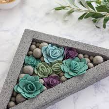 Smoothing out the edges takes up the most time, but since the log planter will be filled with dirt and succulents anyway, it doesn't need be perfect. Concrete Planter Gallery Craftgawker