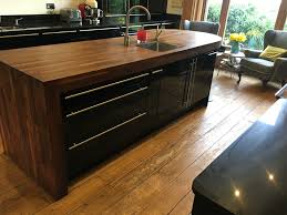 The soft angles of the american walnut kitchen cabinets guide the entry to the adjoining dining room. Large Used Poggenpohl Kitchen The Used Kitchen Company