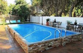 Aufstellpool Mit Gestapelter Steinfassade Home Hinterhof Pool Landschaftsbau Gartenpools Pool Ideen