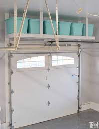 I wanted to create a diy garage storage shelf design that was low cost, required minimal cutting, sturdy, safe. Overhead Garage Storage Shelf Her Tool Belt Overhead Garage Storage Garage Storage Shelves Garage Hanging Storage