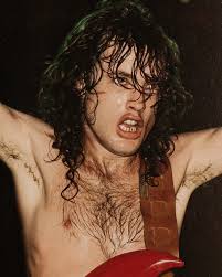 Ultra rare photo of Angus Young with Rose Tattoo