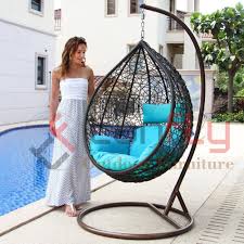 Anthropologie's rattan hanging chair has a lacquered finish and is intended for indoor use; Patio Rattan Garden Wicker Outdoor Furniture Double Seater Outdoor Hammock Egg Hanging Swing Chair By Foshan Tanfly Outdoor Furniture Co Ltd China