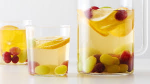 A flight attendant with the drink trolley is talking to a passenger. 24 Non Alcoholic Party Drinks Everyone Will Love Tablespoon Com