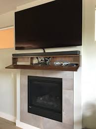 The new mantle makes the fireplace a focal point in the room. Modern Walnut Fireplace Mantel With Drop Front Shelf Media Etsy Fireplace Mantels Fireplace Home Fireplace