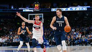 Choose a different game dallas mavericks @ washington wizards new york knicks @ detroit pistons cleveland cavaliers @ miami heat minnesota timberwolves @ philadelphia 76ers orlando magic. Doncic Porzingis Debut Carries Mavs Past Wizards 108 100