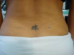 Pin By Rosie Moore On Tattoos Unique Body Piercings Back Piercings Piercing