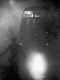 Guiding traffic during the great smog, London, 1952