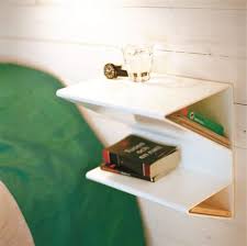 A table is an integral part of any household. Space Saving Wall Mount Bedside Table Shelterness