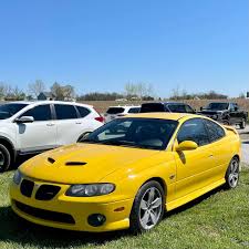 Image result for Yellow 2004 Pontiac