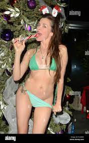 Hoarding: Buried Alive' star Alicia Arden wears only a bikini before  stripping off further to hide her nipples with red ribbon bows as she  decorates a christmas tree Featuring: Alicia Arden Where: