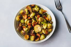 Brussels sprouts are roasted with bacon, maple syrup, and olive oil for a smokey, caramelized side dish. Baked Brussel Sprouts With Bacon Cooking Lsl