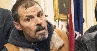 Rioter who menaced officer with Confederate flag gets prison