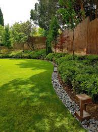 5 Stylish And Functional Garden Edging Ideas Freshome Com Backyard Garden Design Small Backyard Landscaping Backyard Landscaping Designs
