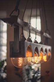 In The Workshopin The Workshop Chandelier Rustic Interior Design Edison Bulb Lamp Mit Bildern Rustikale Leuchten Rustikaler Kronleuchter Lichtdesign