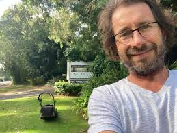 Motel Life. Mowing the front lawn for the first time!