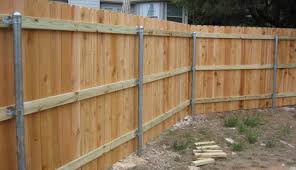 A wood picket fence costs $10 to $14 per foot, while a privacy fence ranges from $13 to $19, and a vinyl fence runs $15 to $30. Low Cost Wood Fences A Better Fence Company Basic Wood Fence