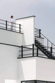 What is an interior railing? Rostam White Villa Designed By Mohammad Reza Kohzadi In Iran In 2021 Balcony Grill Design Balcony Railing Design Villa Design
