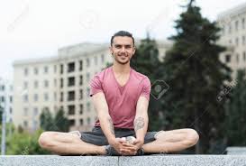Titali asana (butterfly pose) is also similar to the bound angle pose or the baddha kona asana. Portrait Of Young Men Working Out And Doing Butterfly Yoga Pose Outdoors Stock Photo Picture And Royalty Free Image Image 107067155