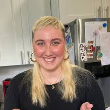 Does anyone know this injured black cat with a white spot at 5th and  Dickinson?