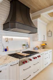 Running the backsplash to the ceiling tends to create a more 'high end' look. High Style Luxury Detailing For A High End Kitchen Remodel Signature Designs Kitchen Bath