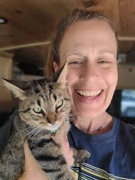 Family of five travels with pets in conversion van