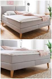 Boxspringbett Jaramillo In Grau Mit Bettfussen Aus Holz Eiche Das Schlichte Design Unterstreicht Den Boxspringbett Boxspringbett Grau Schlichte Schlafzimmer
