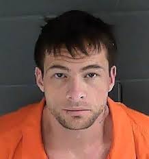 Two arrested after troopers find a pound of meth and stolen handgun