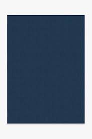 The traditional floral and bordered design of this blue boho rug is washed in a hue of monochromatic slate. Sudaria Solid Teal Blue Rug Washable Rug Ruggable