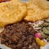 It is a combination of chana masala (spicy white chickpeas) and bhatura/puri, a fried bread made from maida. 1