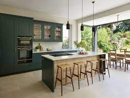 A wooden island with concrete countertops and wooden cabinets are a quiet palette to create a quiet space. Modern Kitchen 23 Modern Kitchen Designs For 2021 New Kitchen